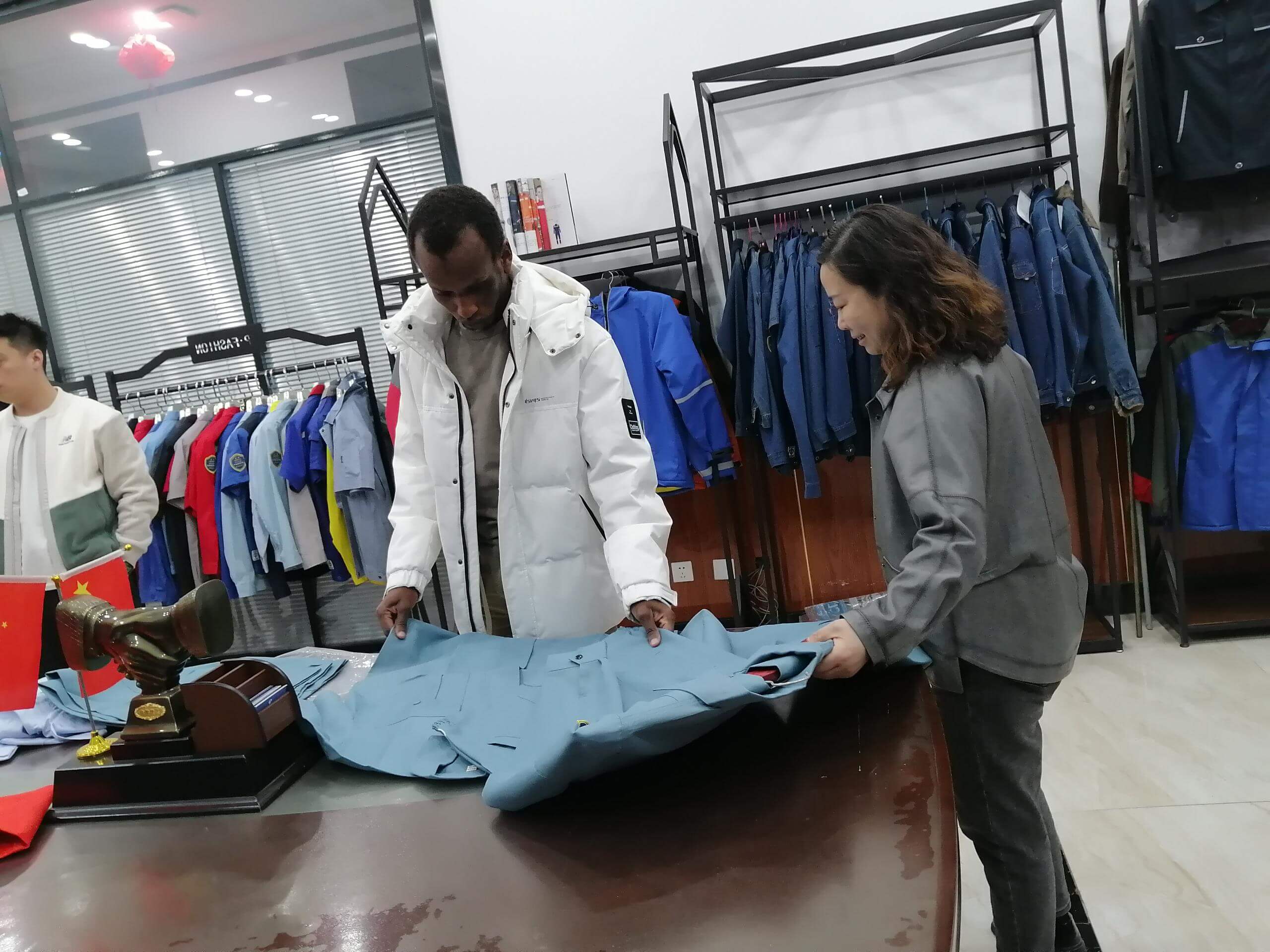 African Congolese clients come to the factory to negotiate contracts