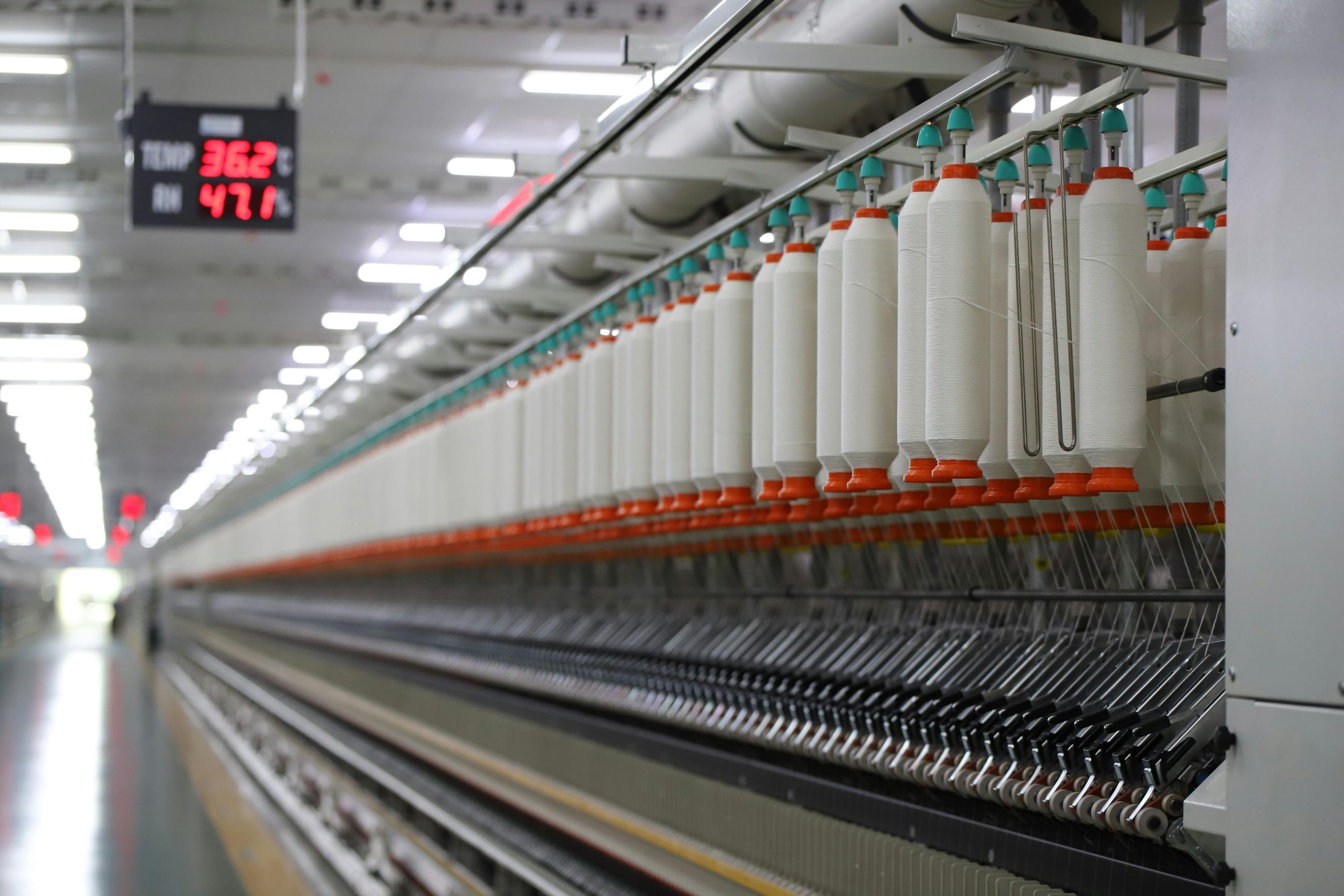 Spinning machines, weaving looms, knitting machines, dyeing units, and sewing machines.